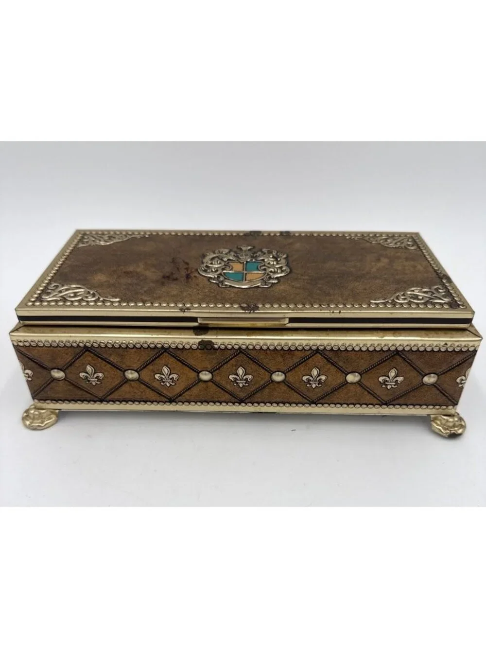 Vtg Ornate Metal Jewelry Box Crest Design Gold & Silver Tones Footed Base